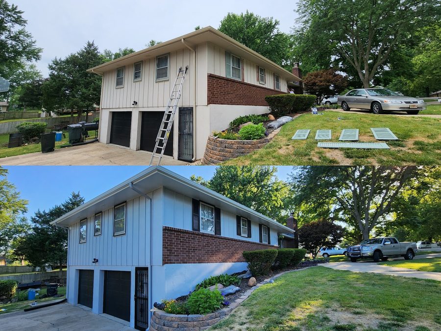 A completed single-story home with a dark exterior, light trim and a front walkway.